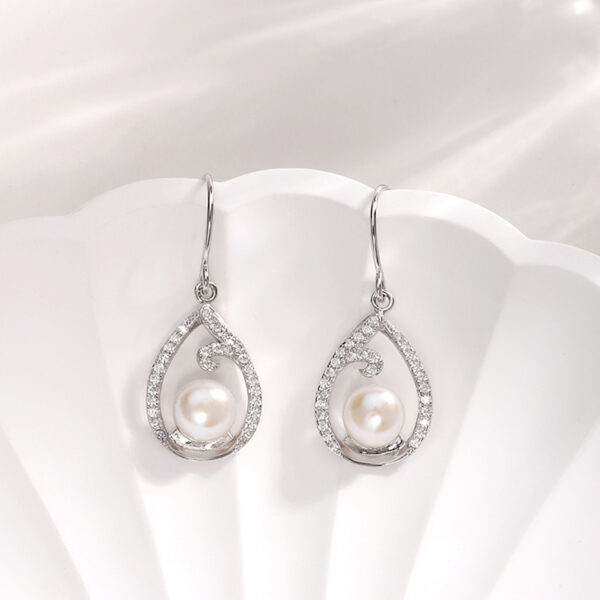 Teardrop Shaped Contour Hanging Pearl Earrings - Image 4