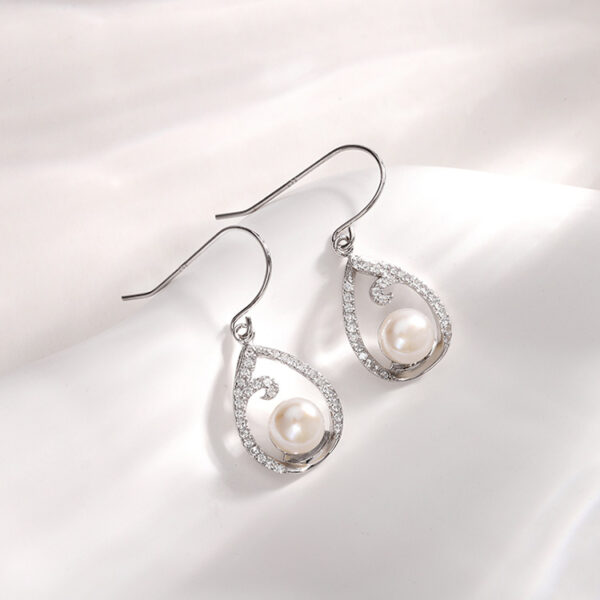 Teardrop Shaped Contour Hanging Pearl Earrings - Image 5