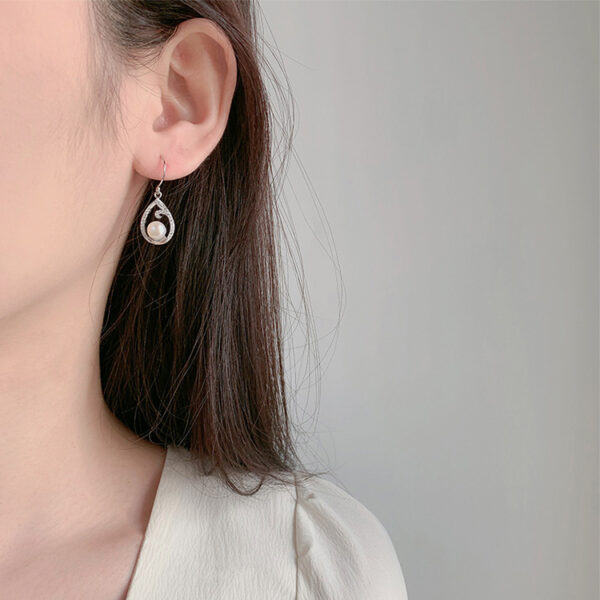 Teardrop Shaped Contour Hanging Pearl Earrings - Image 2